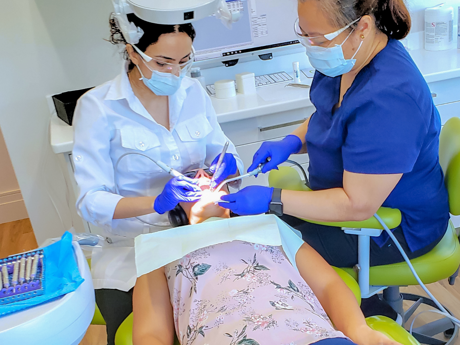 Dr Nourian doing dental exam on patient